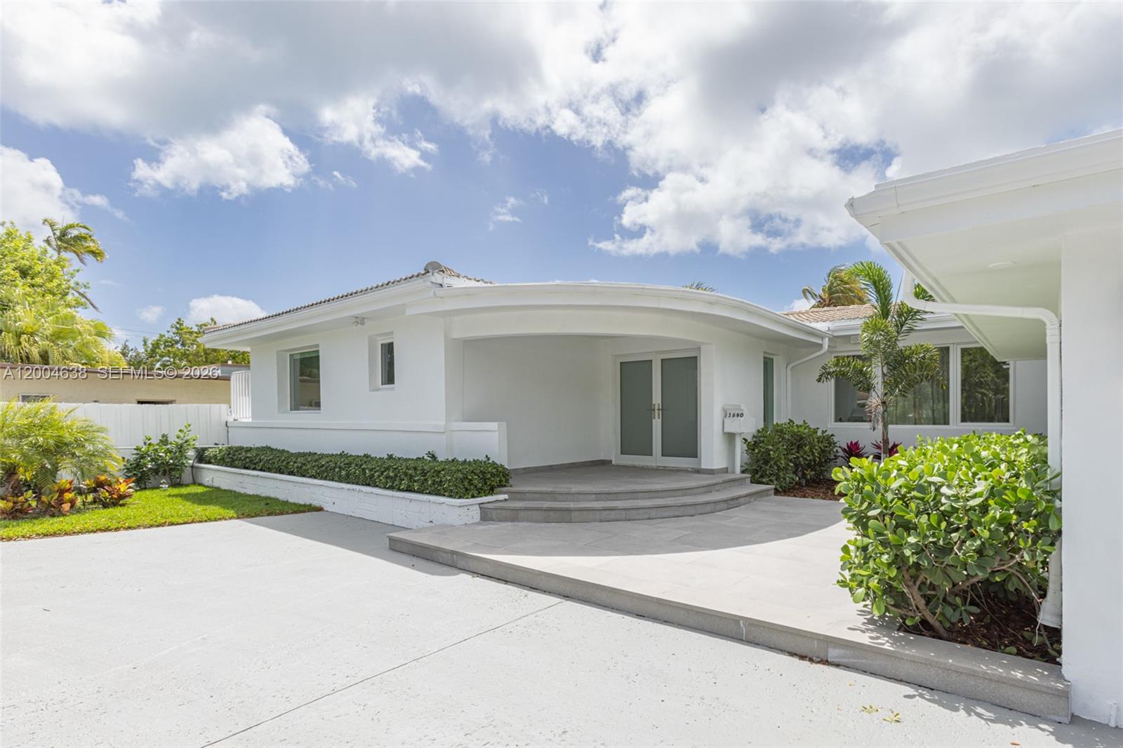 1690 Daytonia Road Miami Beach, FL 33141 - Photo 46 of 88 a front view of house with yard and green space