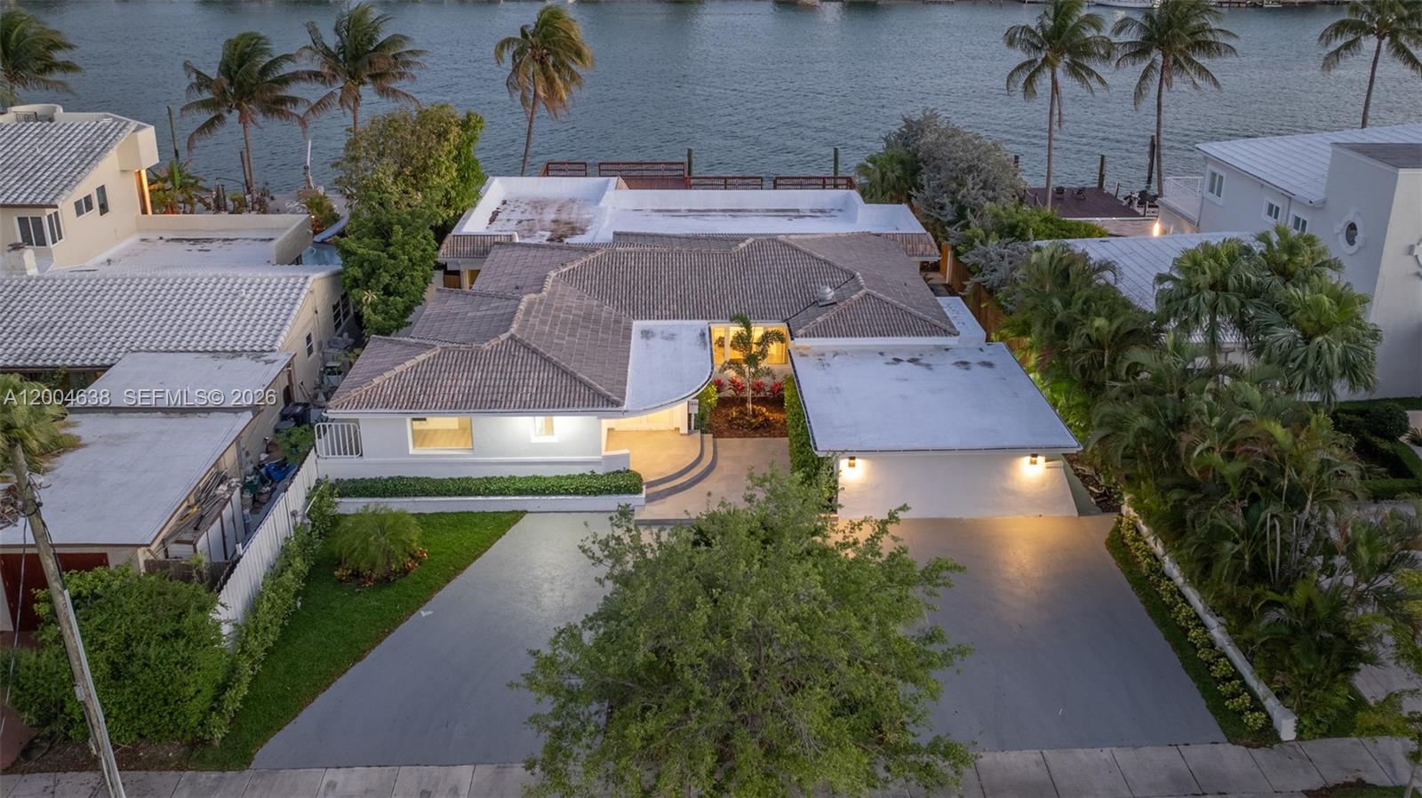1690 Daytonia Road Miami Beach, FL 33141 - Photo 5 of 88 an aerial view of a house with a yard and potted plants