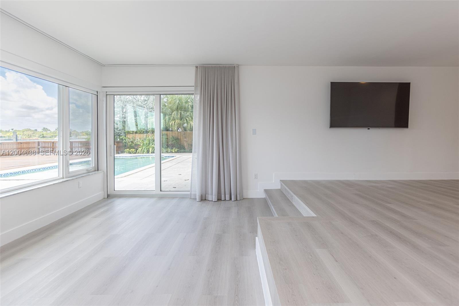 1690 Daytonia Road Miami Beach, FL 33141 - Photo 70 of 88 a view of a livingroom with an empty space and a window