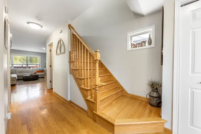 a view of a livingroom with furniture and stairs