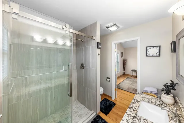 a bathroom with a sink and shower