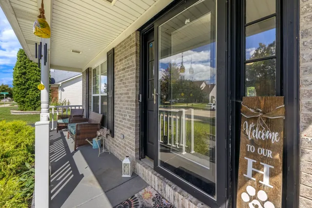 a view of a balcony with wooden floor