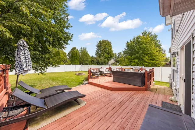 a view of a swimming pool with a lounge chair
