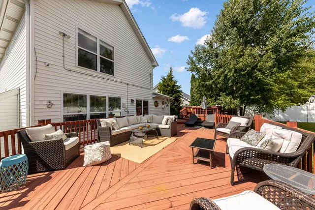 a view of a patio with couches and potted plants