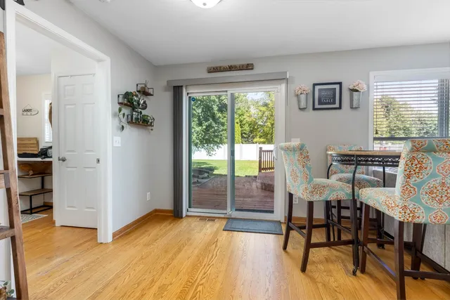 a view of a livingroom with furniture window and wooden floor