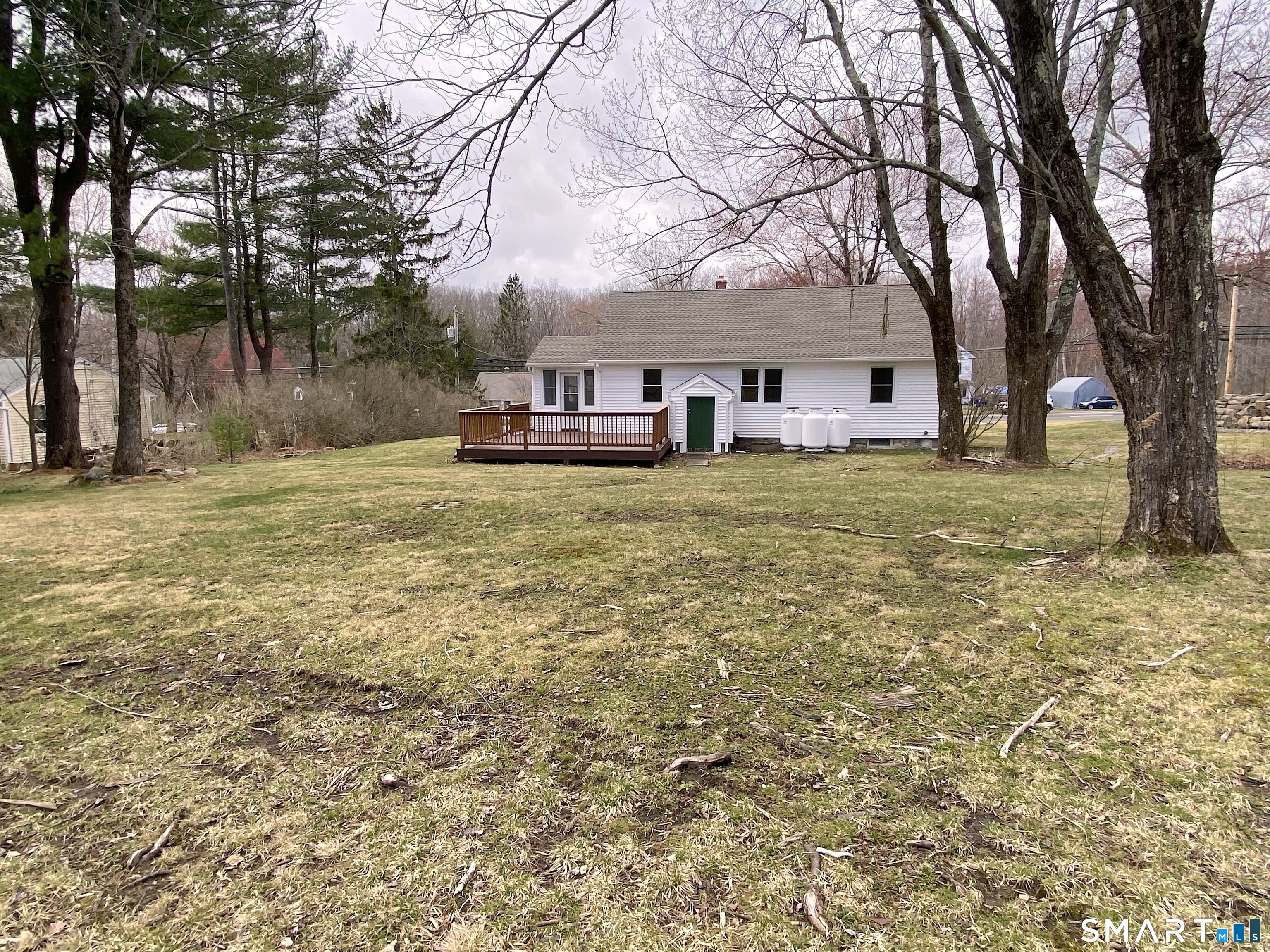 374 Torrington Road Litchfield, CT 06759 - Photo 3 of 28 a house with trees in front of it