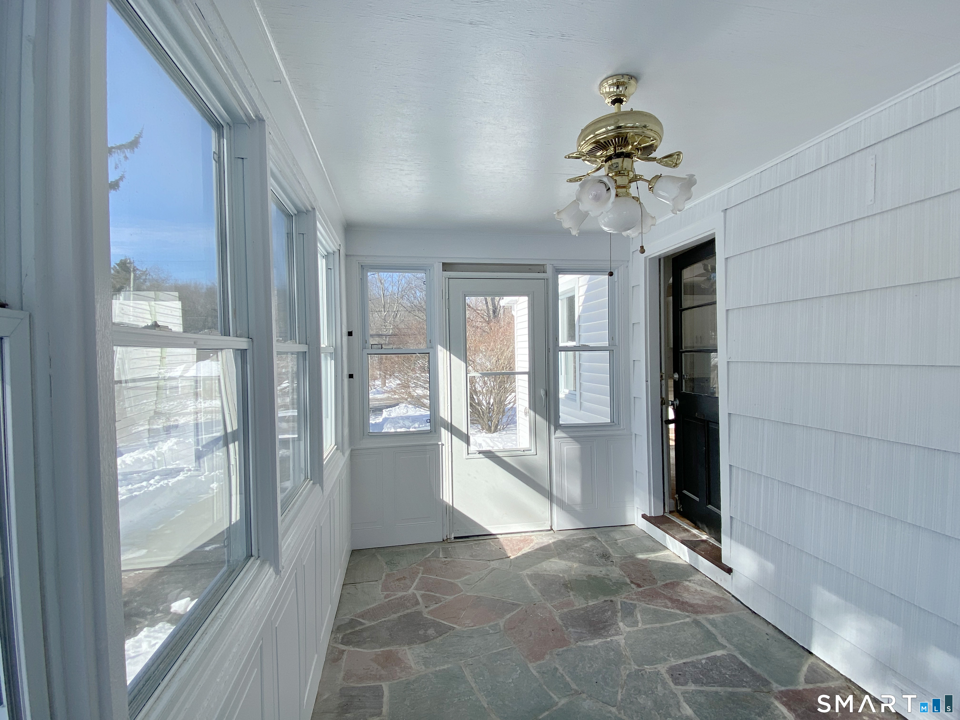 374 Torrington Road Litchfield, CT 06759 - Photo 6 of 28 a view of a hallway with a chandelier