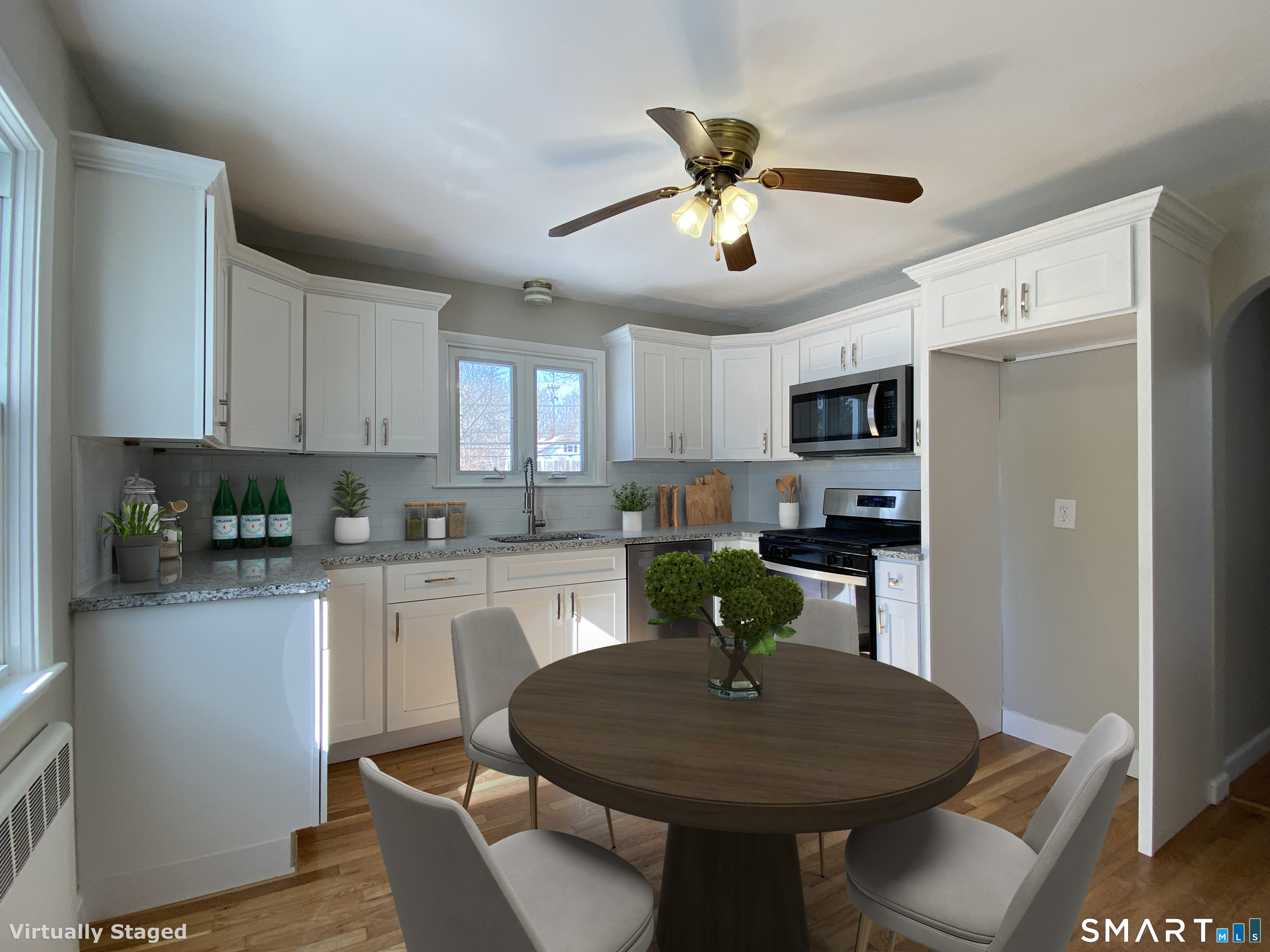 374 Torrington Road Litchfield, CT 06759 - Photo 7 of 28 a kitchen with a dining table cabinets appliances and wooden floor