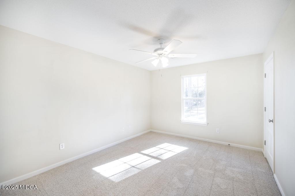 204 Chimney Rock Road Perry, GA 31069 - Photo 20 of 28 an empty room with a window
