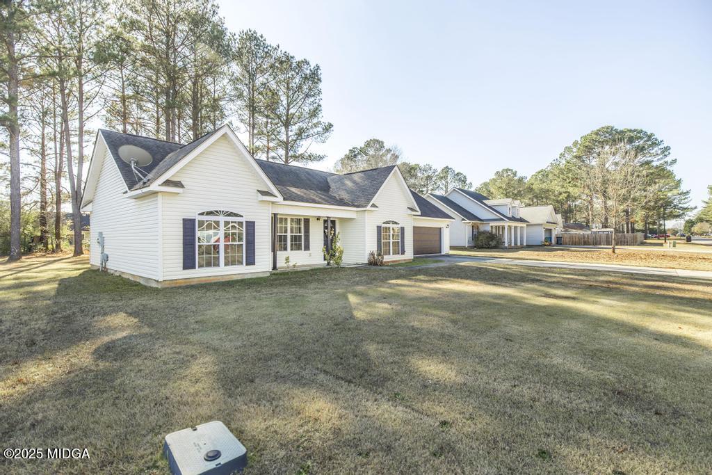 204 Chimney Rock Road Perry, GA 31069 - Photo 2 of 28 a view of a house with a yard