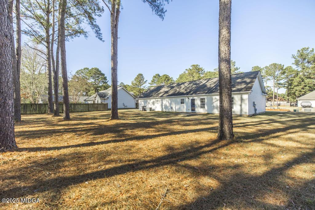204 Chimney Rock Road Perry, GA 31069 - Photo 27 of 28 a view of a swimming pool with a yard