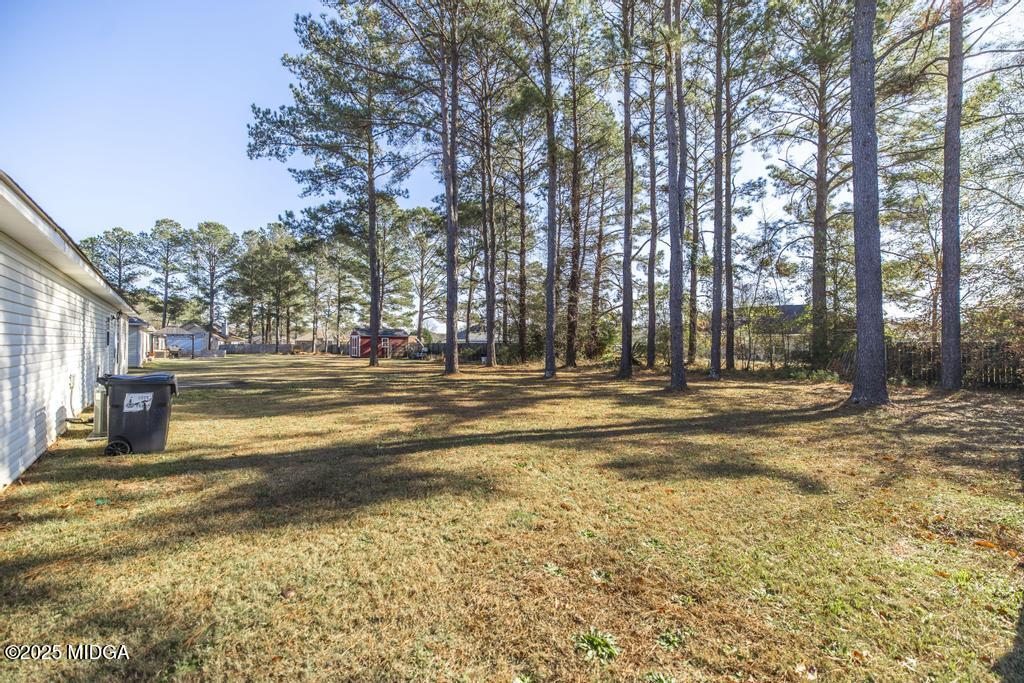 204 Chimney Rock Road Perry, GA 31069 - Photo 28 of 28 a view of a building with trees in the background