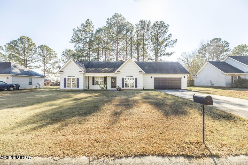 204 Chimney Rock Road Perry, GA 31069 - Photo 3 of 28 a front view of a house with a yard