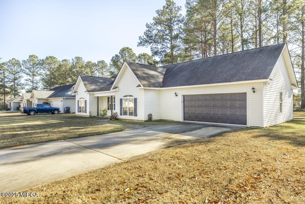 204 Chimney Rock Road Perry, GA 31069 - Photo 4 of 28 a view of street along with house and trees