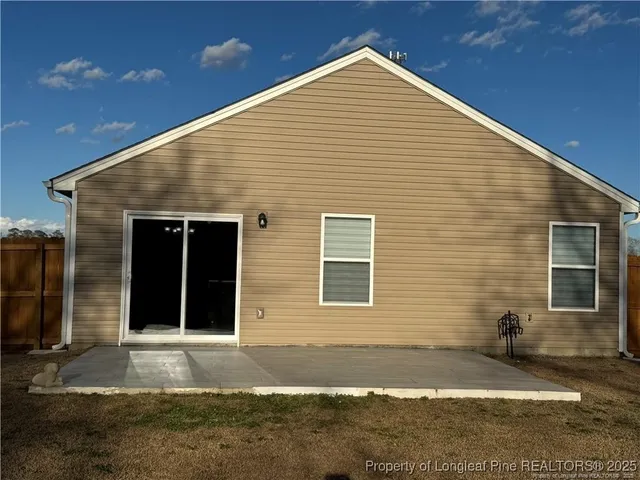 a view of backyard with green space