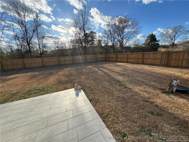 a view of a yard with a house