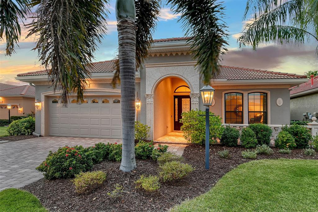 7312 Riviera Cove Lakewood Ranch, FL 34202 - Photo 1 of 1 Exterior front close-up. Twilight view.