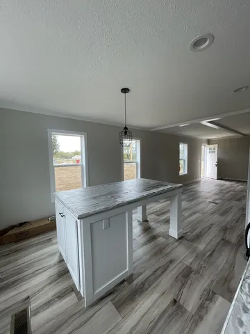 a kitchen that has a lot of cabinets in it