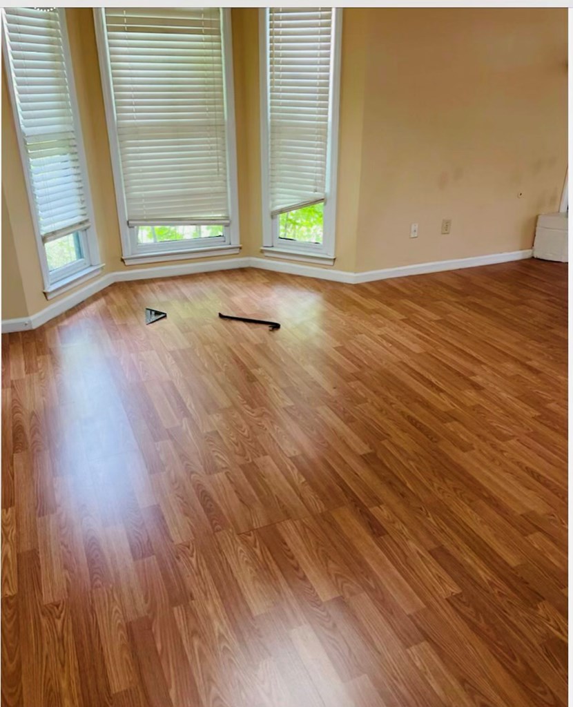 5824 Cameo Court Columbus, GA 31907 - Photo 2 of 6 a view of an empty room with wooden floor and a window