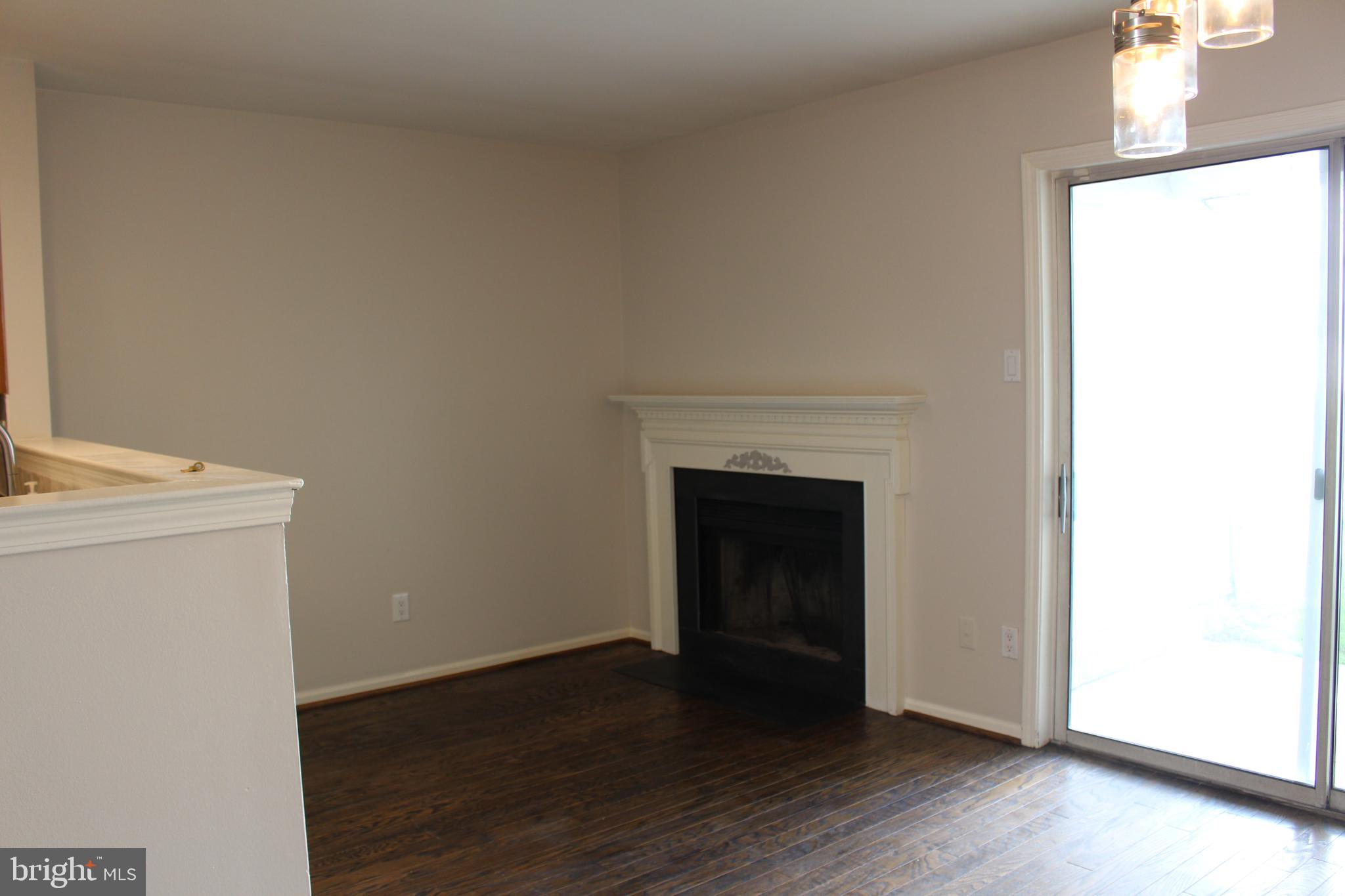 175 Leedom Way Newtown, PA 18940 - Photo 13 of 36 a view of a livingroom with wooden floor and a fireplace