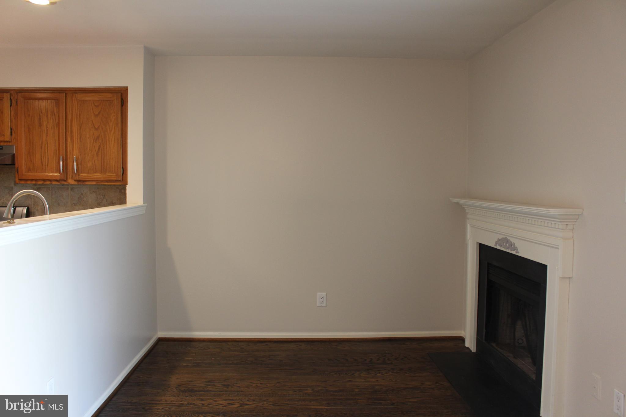 175 Leedom Way Newtown, PA 18940 - Photo 14 of 36 a view of a hallway with wooden floor and a sink