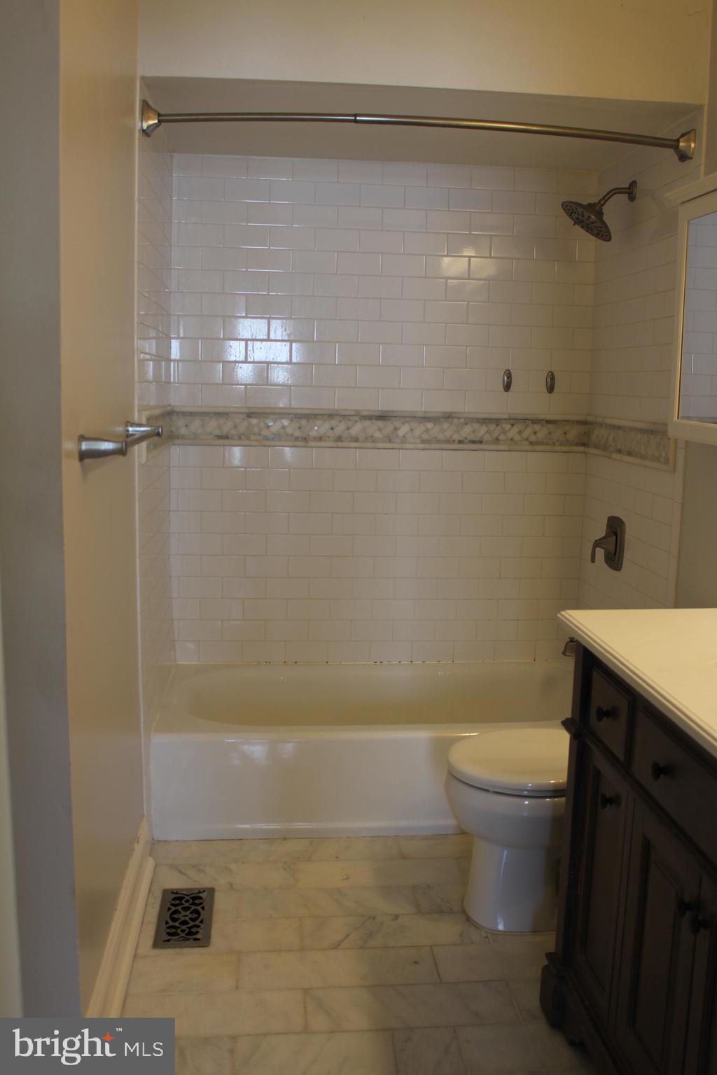 175 Leedom Way Newtown, PA 18940 - Photo 24 of 36 a bathroom with a granite countertop bathtub shower sink and toilet