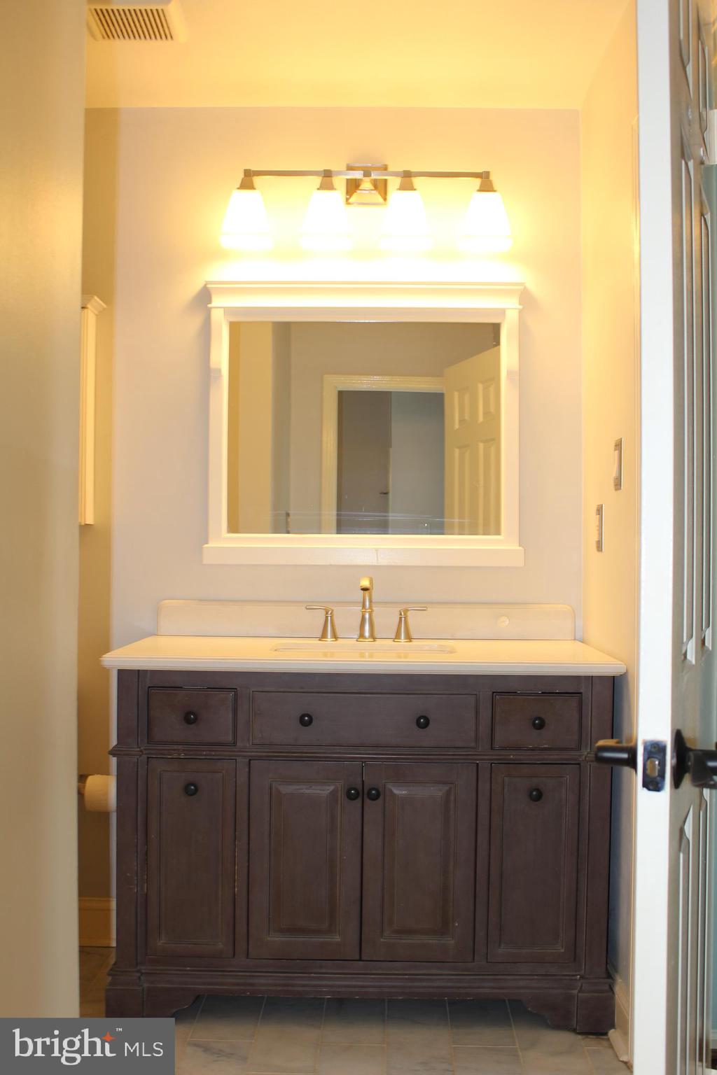 175 Leedom Way Newtown, PA 18940 - Photo 26 of 36 a bathroom with a sink and a mirror