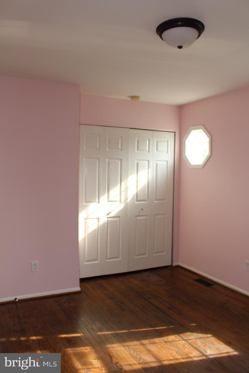 175 Leedom Way Newtown, PA 18940 - Photo 30 of 36 an empty room with wooden floor and windows