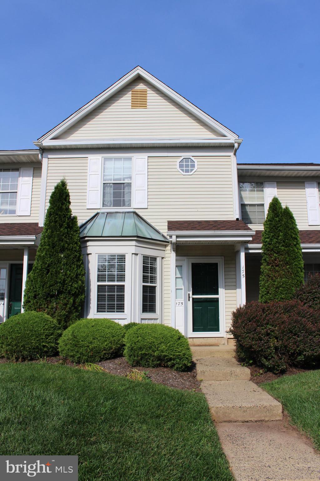 175 Leedom Way Newtown, PA 18940 - Photo 3 of 36 a front view of a house with a yard and garage