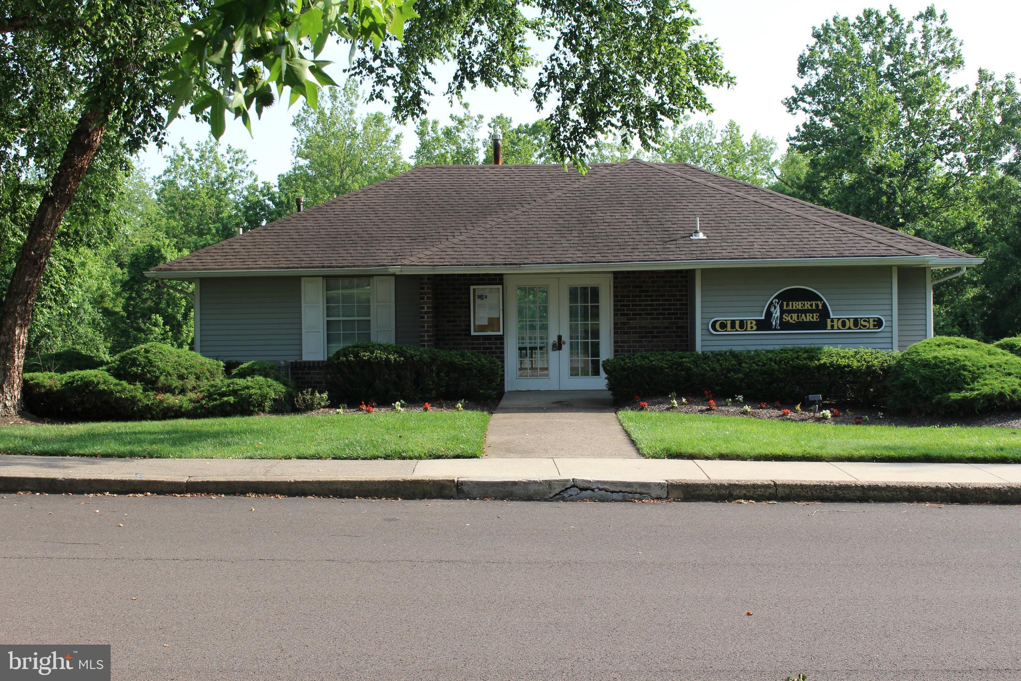 175 Leedom Way Newtown, PA 18940 - Photo 34 of 36 a front view of a house with a yard and trees