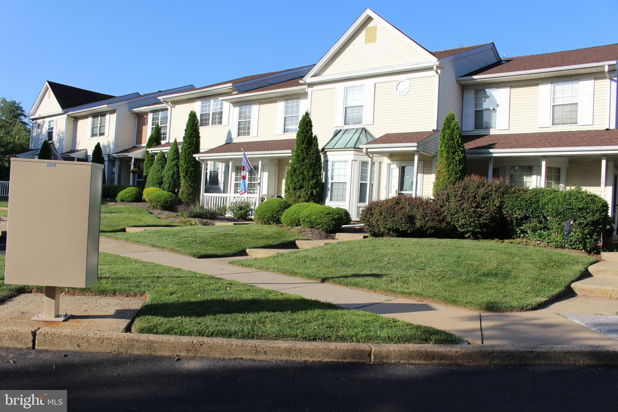 175 Leedom Way Newtown, PA 18940 - Photo 5 of 36 a front view of a house with a garden and plants