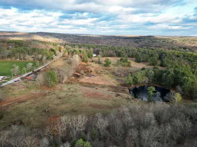 a view of a field with an ocean