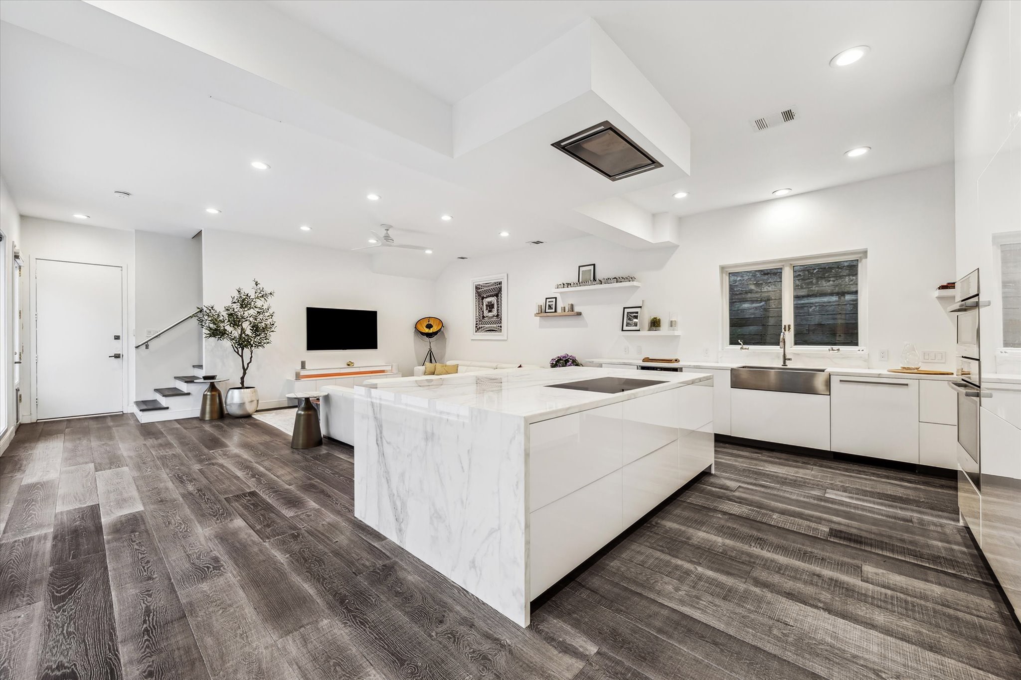 2114 Wroxton Road Houston, TX 77005 - Photo 17 of 48 a white kitchen with a sink and a large window