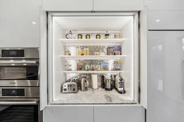 a kitchen with a refrigerator and a sink