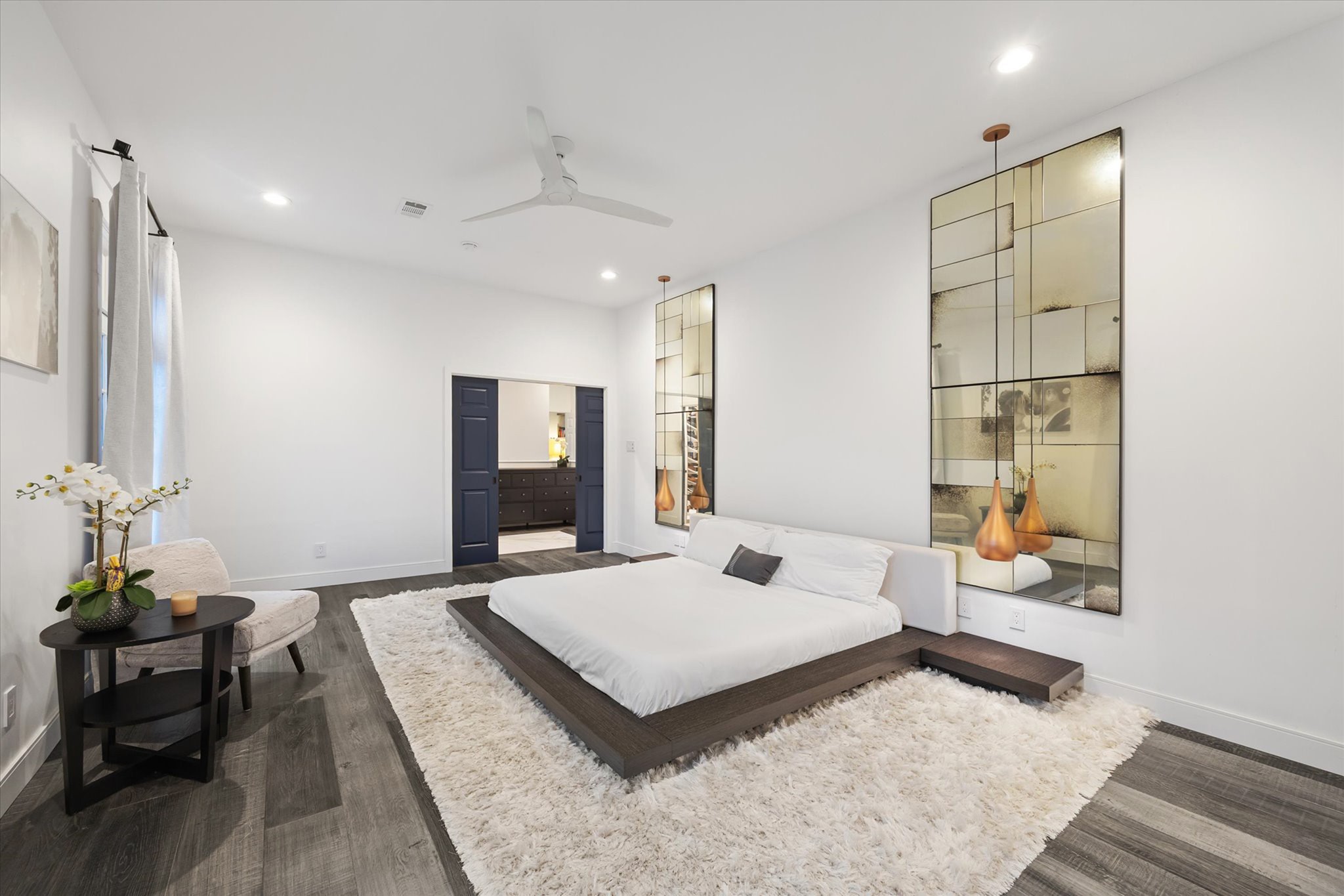 2114 Wroxton Road Houston, TX 77005 - Photo 22 of 48 a bedroom with a large bed and a couch