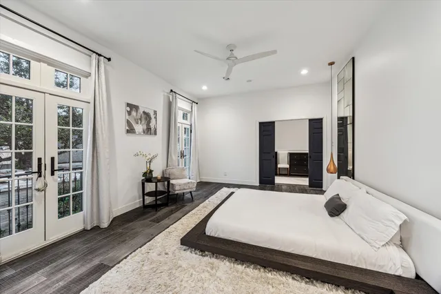 a large white bed in a white room