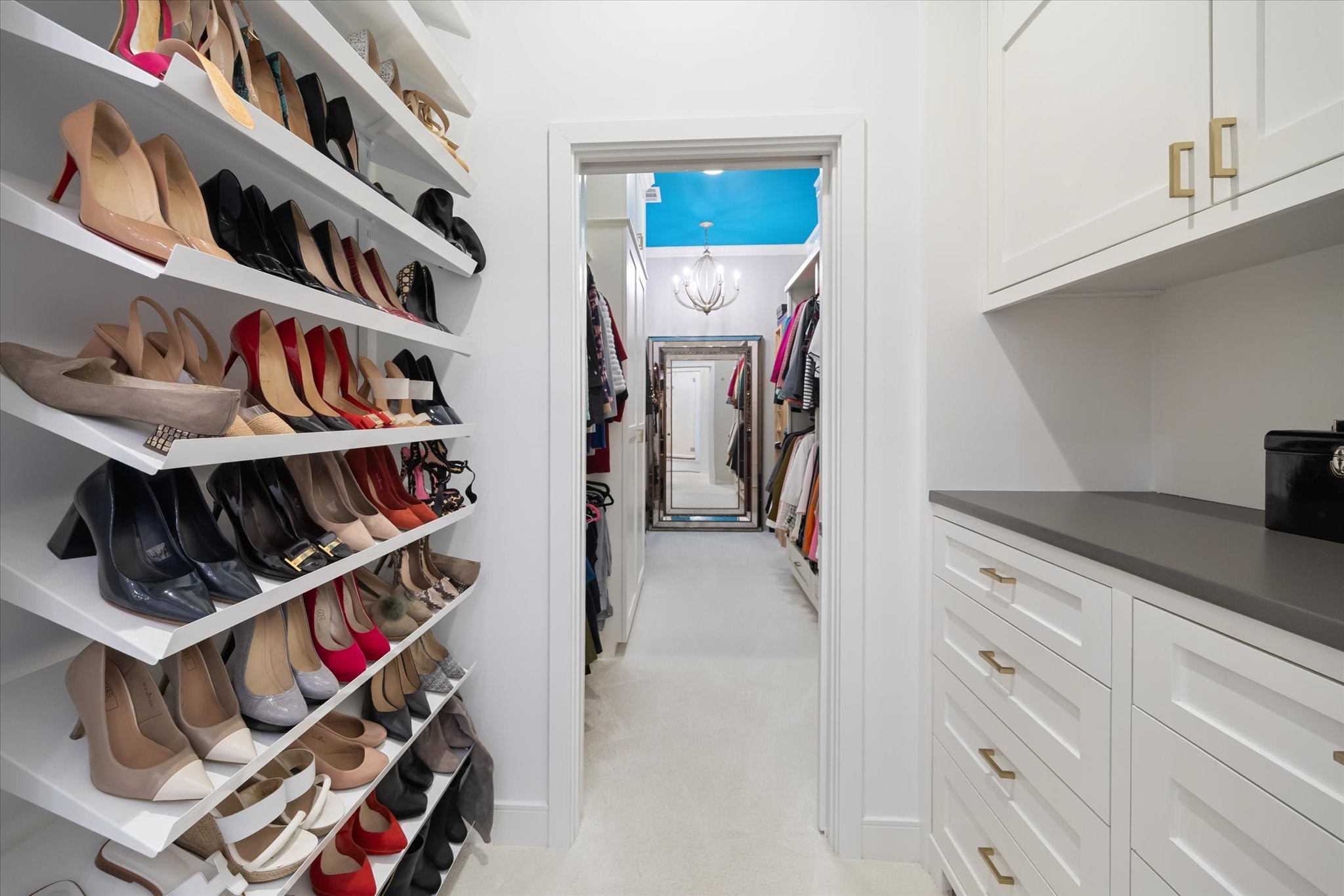 2114 Wroxton Road Houston, TX 77005 - Photo 30 of 48 a view of walk in closet with clothes and shoes