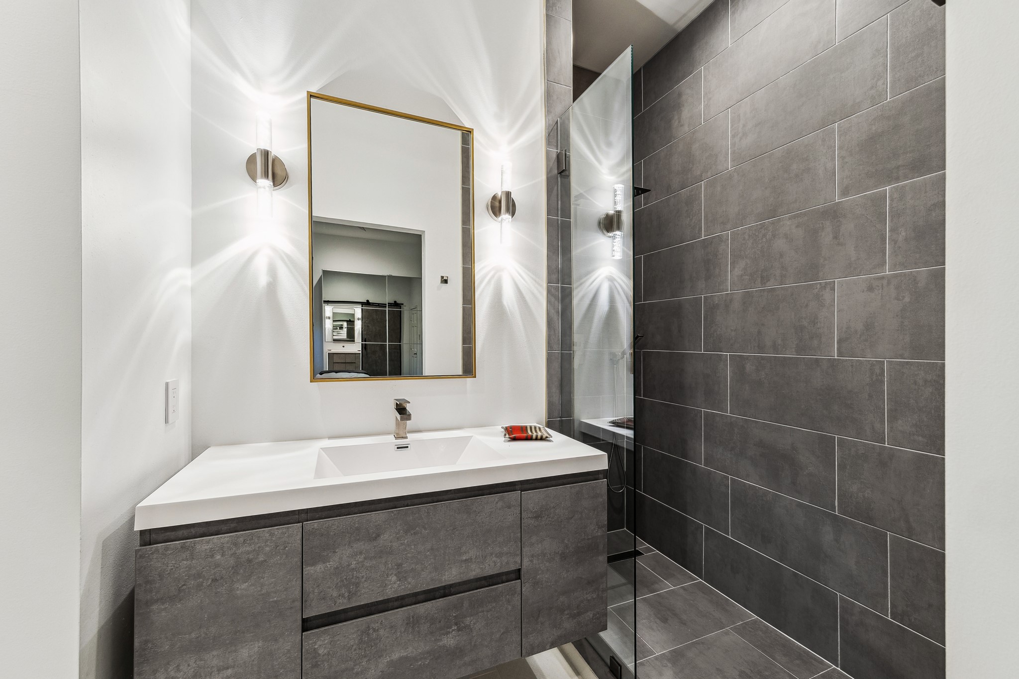 2114 Wroxton Road Houston, TX 77005 - Photo 35 of 48 a bathroom with a sink mirror and a shower