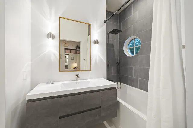 a bathroom with a sink and a mirror