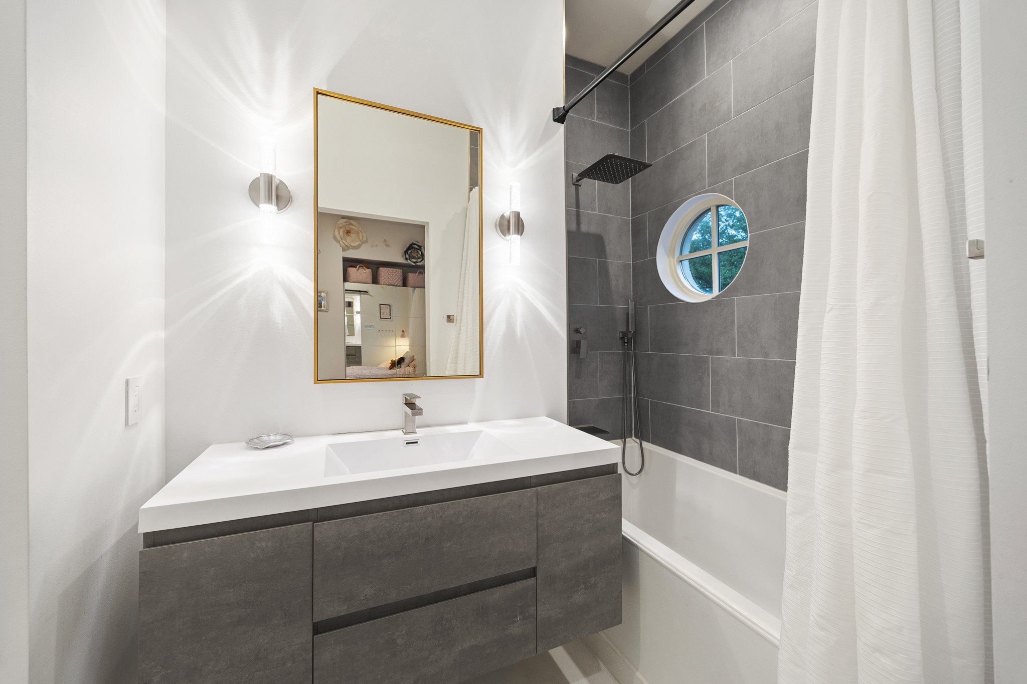 2114 Wroxton Road Houston, TX 77005 - Photo 37 of 48 a bathroom with a sink and a mirror