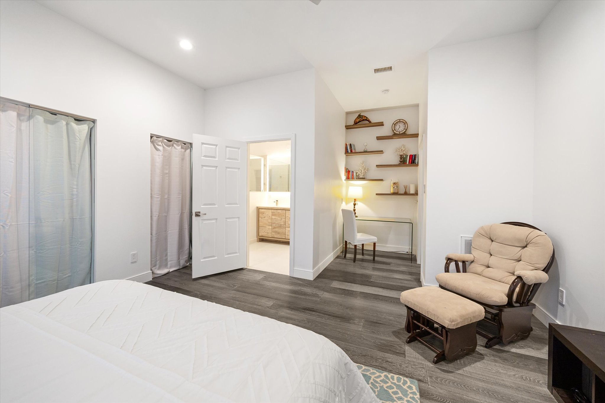 2114 Wroxton Road Houston, TX 77005 - Photo 38 of 48 a bedroom with a bed and wooden floor