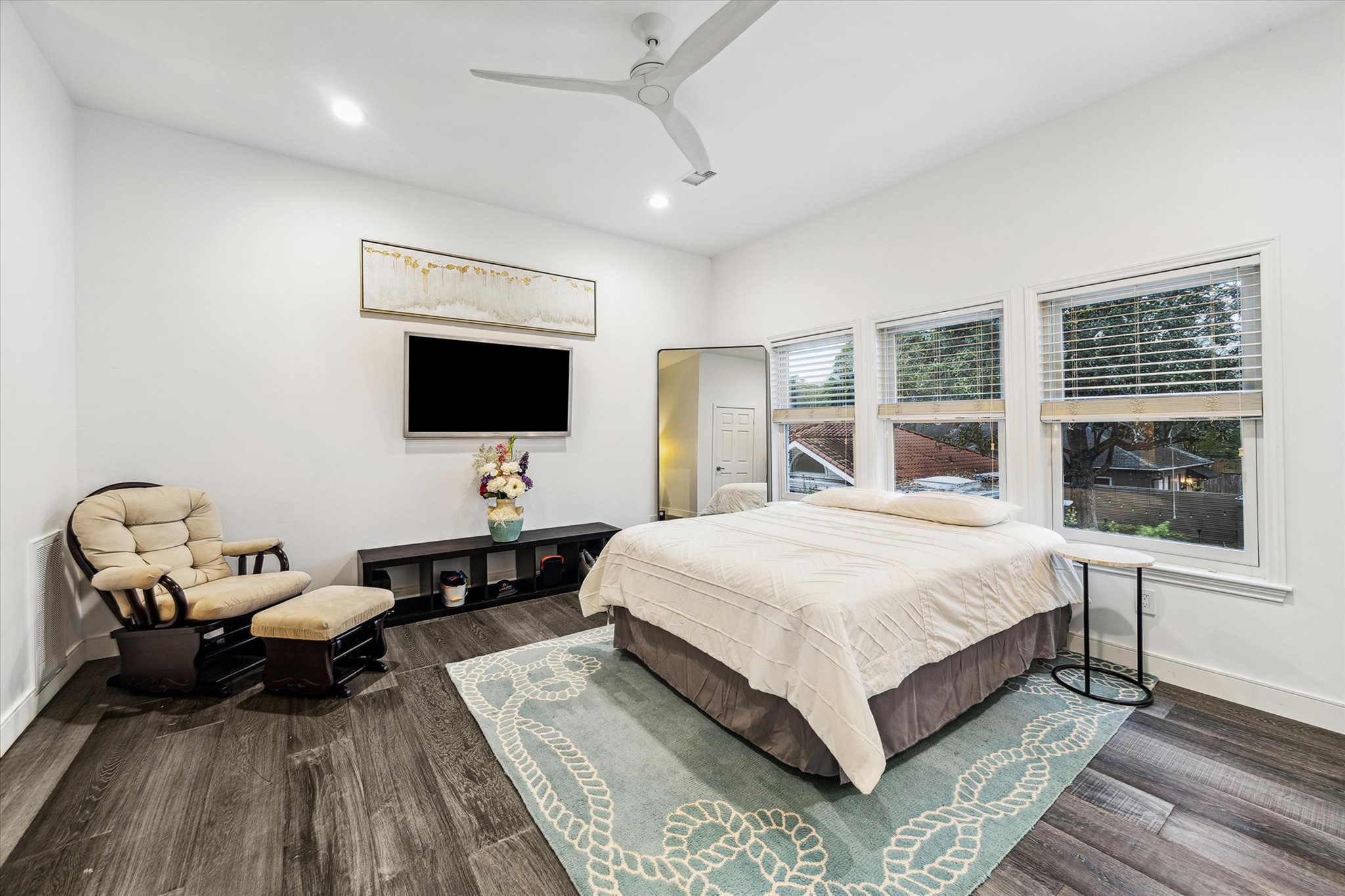 2114 Wroxton Road Houston, TX 77005 - Photo 39 of 48 a spacious bedroom with a bed and a flat screen tv