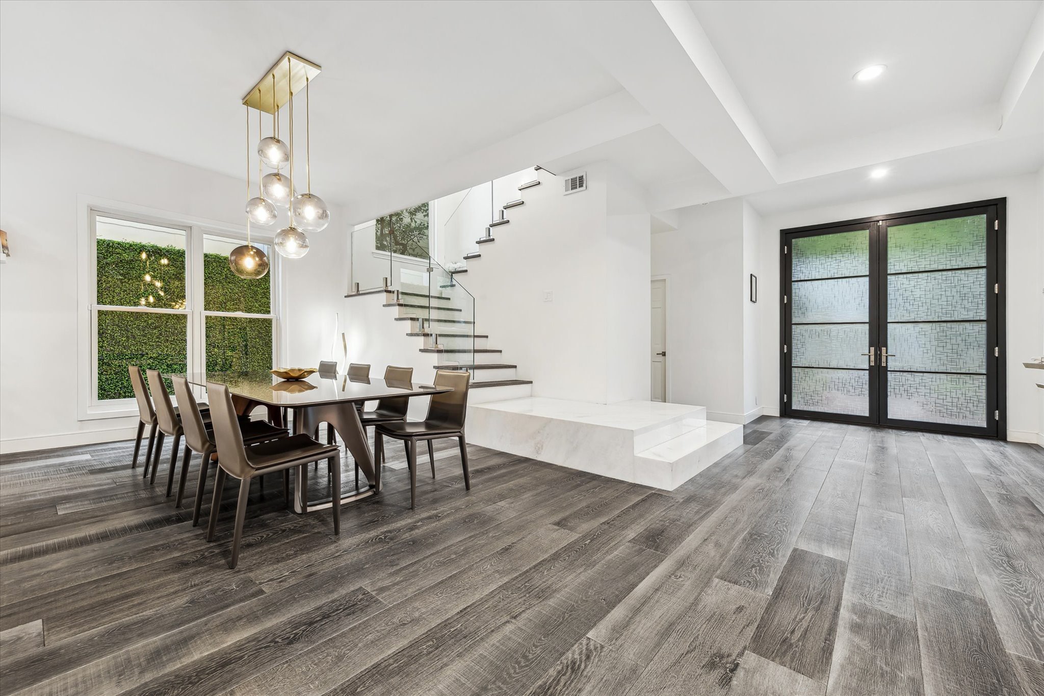 2114 Wroxton Road Houston, TX 77005 - Photo 8 of 48 a view of a dining room with furniture and wooden floor