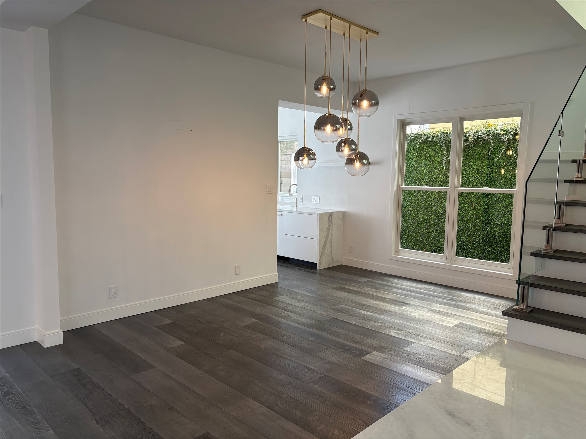 2114 Wroxton Road Houston, TX 77005 - Photo 10 of 48 a view of a livingroom with wooden floor and a window