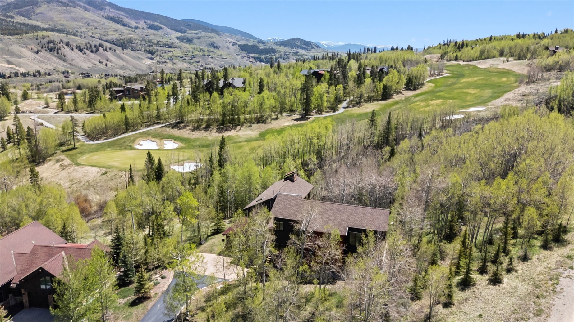 2800 Hunter's Knob Road Silverthorne, CO 80498 - Photo 36 of 37 a view of a garden with a building in the background