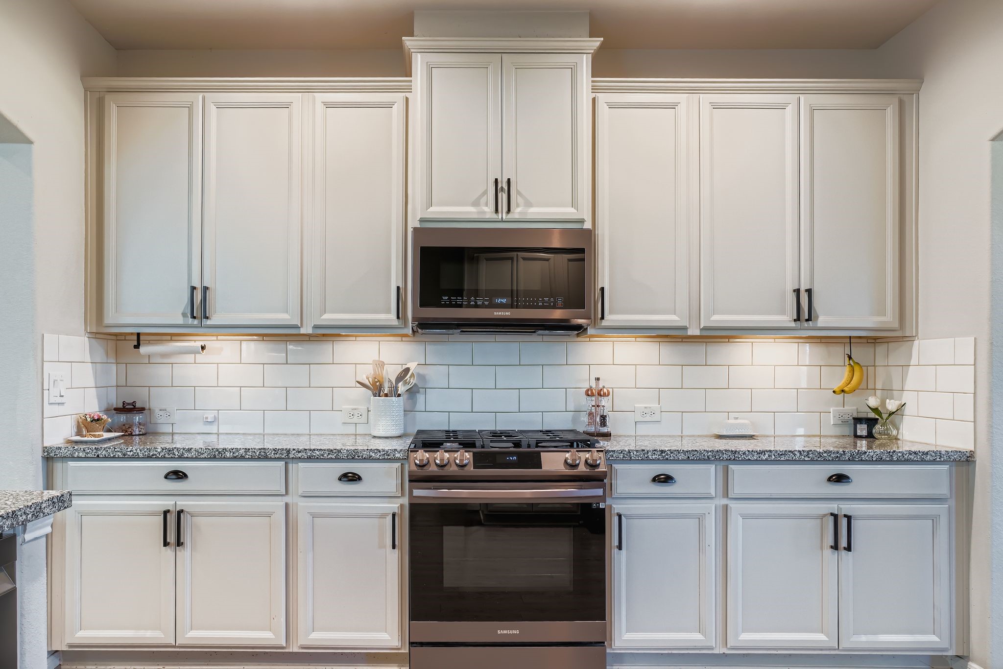 2614 Wembley Way Rosenberg, TX 77471 - Photo 11 of 24 a kitchen with white cabinets and stainless steel appliances