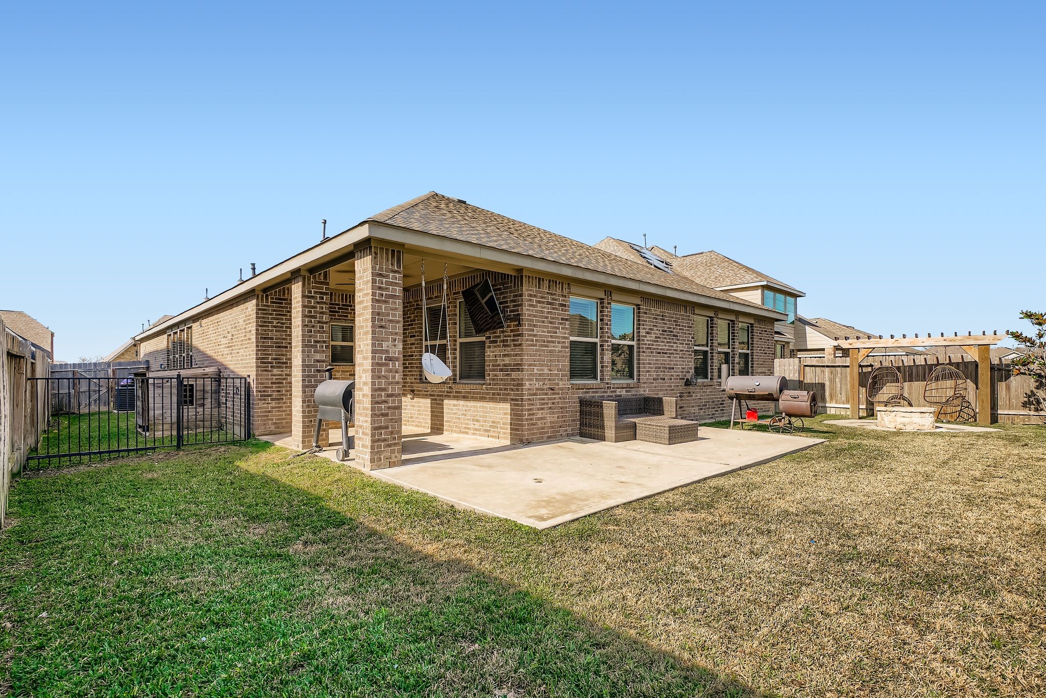 2614 Wembley Way Rosenberg, TX 77471 - Photo 22 of 24 a view of a house with a yard and sitting area
