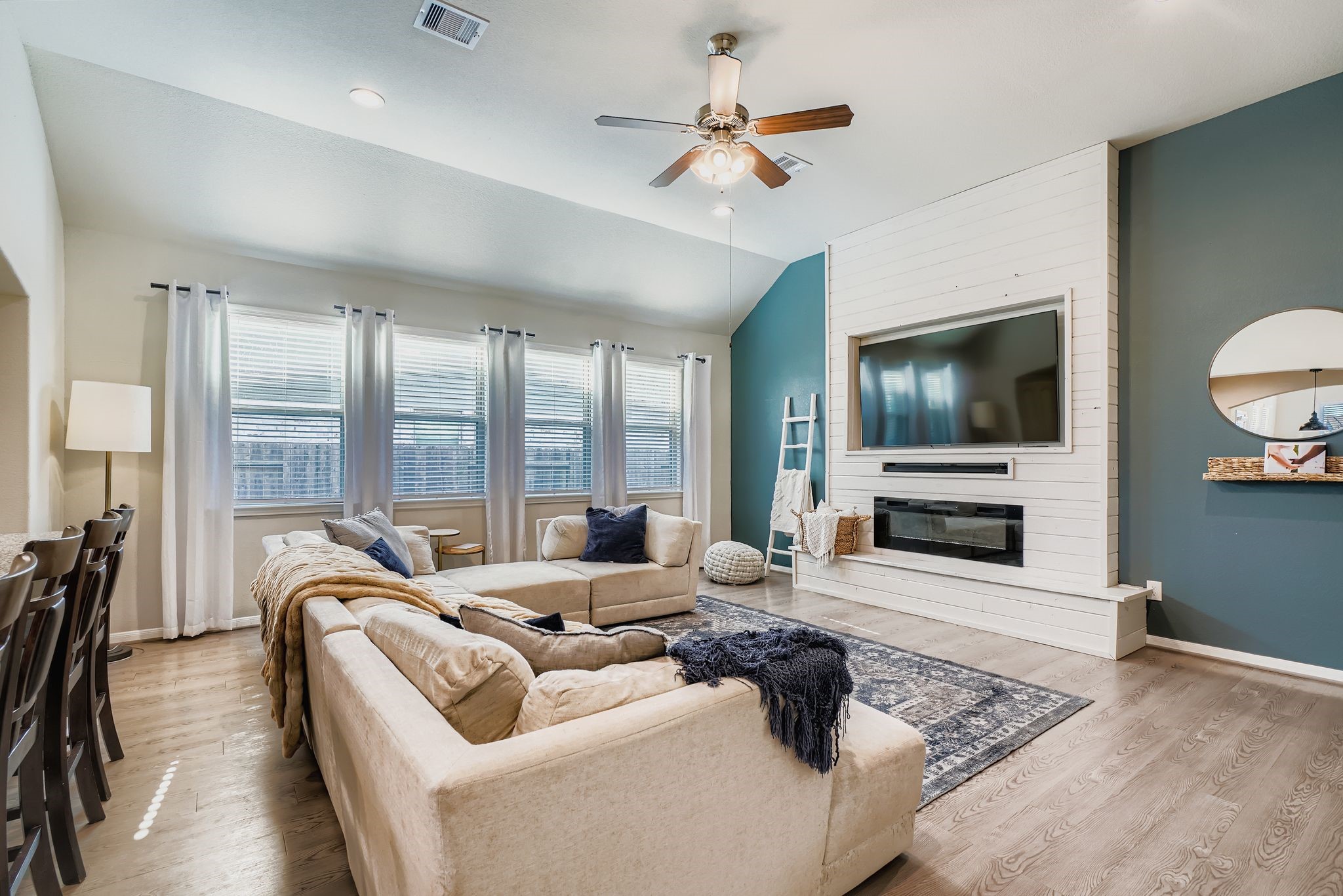 2614 Wembley Way Rosenberg, TX 77471 - Photo 7 of 24 a living room with furniture ceiling fan and a flat screen tv