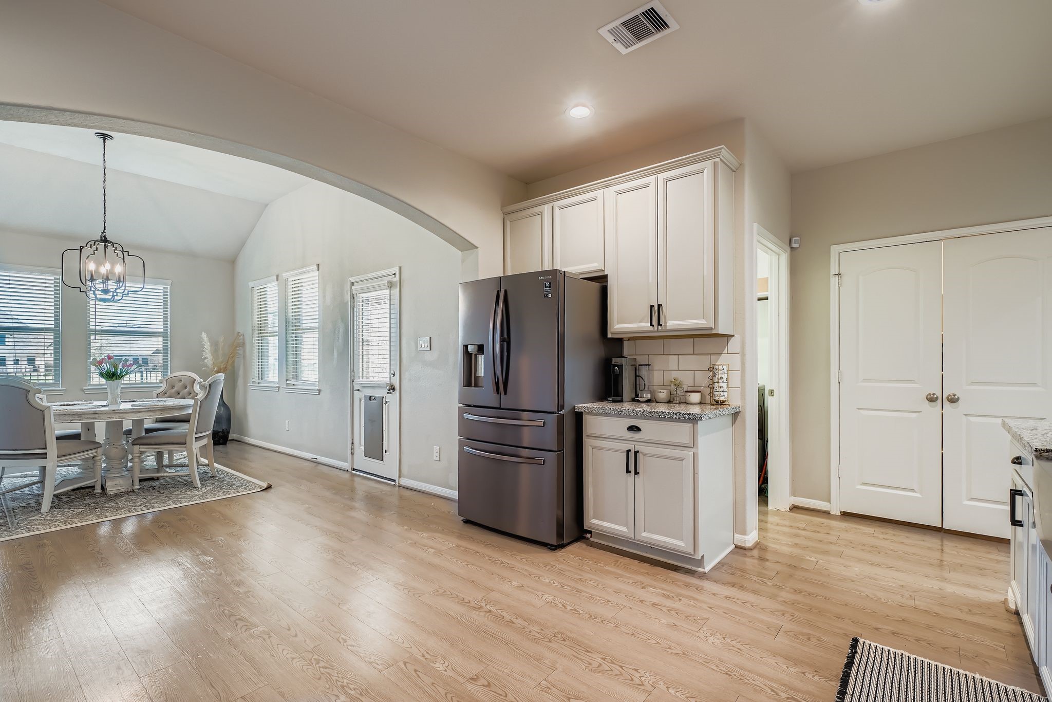 2614 Wembley Way Rosenberg, TX 77471 - Photo 10 of 24 a kitchen with a refrigerator stove and wooden floor