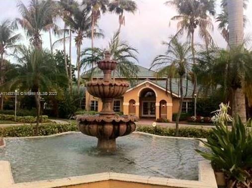 4055 West McNab Road, Unit H303 Pompano Beach, FL 33069 - Photo 15 of 29 a front view of a house with garden